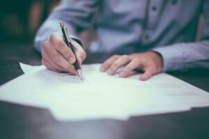 signing legal document for licensing